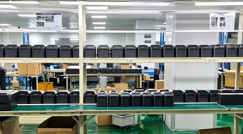 CRSMT label printer production line with shelves of finished thermal and RFID label printers ready for global OEM shipment